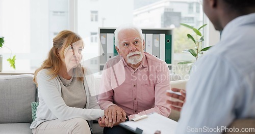 Image of Counseling, support and senior couple with therapist in consultation for help, talk or crisis guidance. Therapy, depression and old people holding hands consulting marriage or mental health expert
