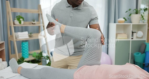 Image of Physiotherapy, legs rehabilitation or person with patient for support, recovery in body motion training in health office. Physical therapy, clinic or physiotherapist help client with mobility problem