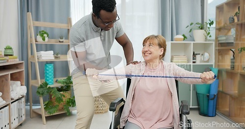 Image of Senior woman with disability, physiotherapy and stretching band for muscle rehabilitation, physical therapy and chiropractor service. Physiotherapist, medical support and happy patient in wheelchair