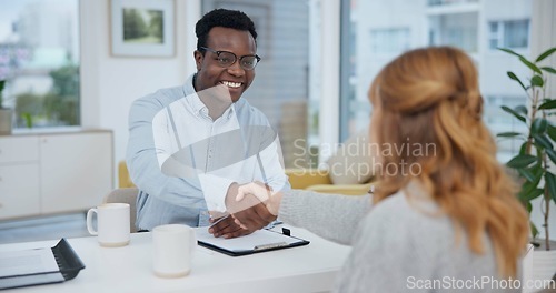 Image of Handshake, contract and consulting with lawyer and client for planning, signature or deal. Financial advisor, legal documents and agreement with black man and woman in law firm for life insurance