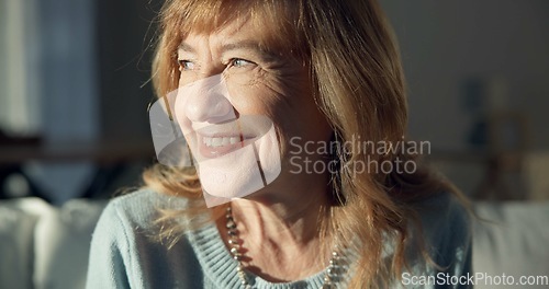 Image of Happy, thinking and a senior woman on the sofa in a home living room for peace, calm and retirement. Smile, idea and an elderly person with a vision, hope and relax on the lounge couch of a house