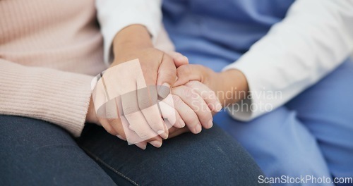 Image of Closeup, support and holding hands with nurse with old woman on sofa for empathy, volunteer and trust. Healthcare, retirement and rehabilitation with patient and caregiver in nursing home for healing