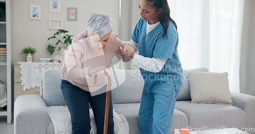 Image of Caregiver support, disabled and old woman with walking stick for help, senior wellness care or old age movement disability. Retirement, nursing home volunteer or nurse helping patient with getting up