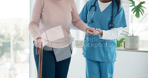 Image of Caregiver hands, disabled and old woman with walking stick for support, senior wellness care or movement disability. Elderly rehabilitation service, retirement home and nurse help patient with cane