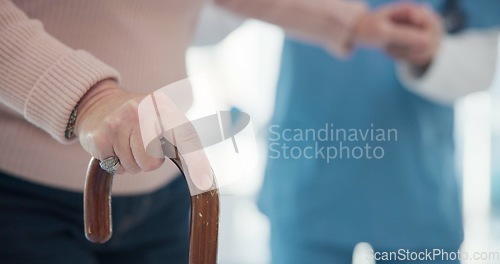 Image of Nurse, disabled and old person hands with walking stick for support, elderly care or movement disability. Senior rehabilitation service, retirement home physiotherapy or worker help patient with cane