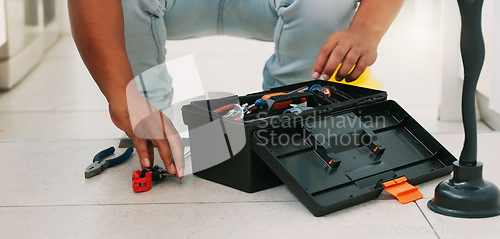 Image of Repair, kitchen and man with box of tools for home construction, fixing and plumbing maintenance. Manual labor, DIY plumber and handyman pack equipment after working on sewer pipe, sink and plumbing