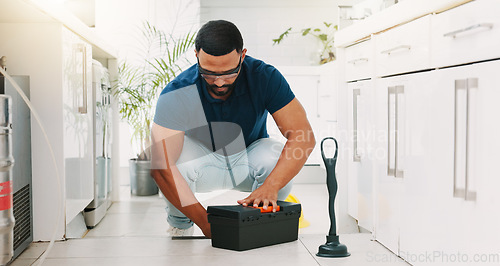 Image of Plumber man, tools and box on floor maintenance with packing, focus and pipe repair service in house. Entrepreneur handyman, plumbing expert and small business owner with toolbox in home kitchen