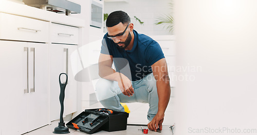 Image of Plumber man, tools and box on floor maintenance with packing, focus and pipe repair service in house. Entrepreneur handyman, plumbing expert and small business owner with toolbox in home kitchen