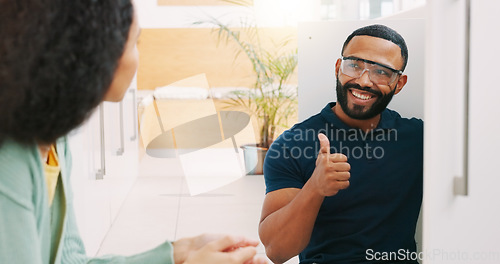 Image of Plumber man, woman and explain in kitchen for sink maintenance with customer support in home. Entrepreneur handyman smiling, plumbing agreement or small business owner with thumbs up for fixing water