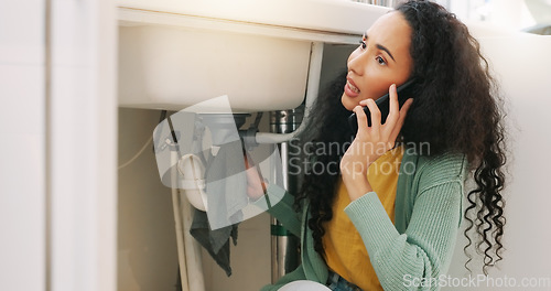 Image of Sink leak, plumbing and woman on a phone call for maintenance, plumber service and home construction. Communication, manual labour and stressed girl calling handyman for faucet, pipes or kitchen leak