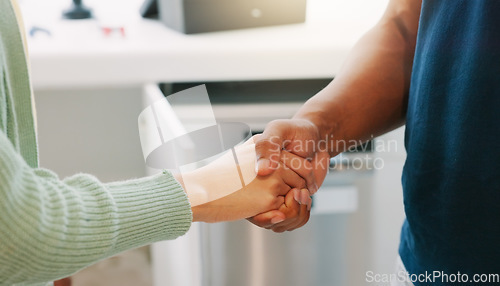 Image of Handshake, kitchen and closeup with man, woman and agreement for plumbing services in home. Shaking hands, plumber and client with thank you for maintenance, repair and consulting in house for job