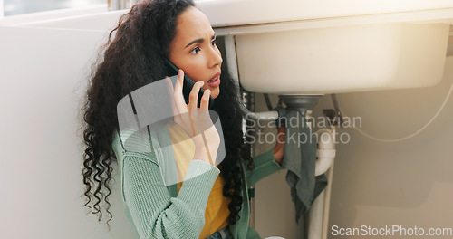 Image of Sink repair, plumbing and woman on a phone call for maintenance, plumber service and home construction. Communication, manual labour and girl calling handyman for faucet problem, leak or kitchen pipe