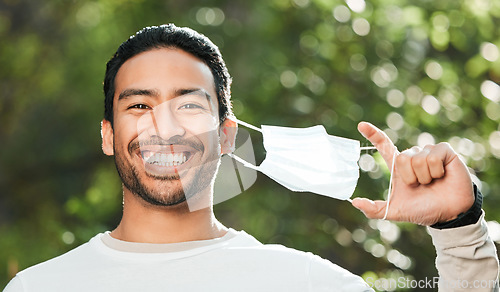 Image of Man, face mask and forest with smile, portrait and freedom for wellness, health and breathing in sunshine. Asian guy, covid ppe and excited for medical protection, immune system and outdoor in woods