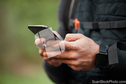 Image of Closeup, man or athlete with a smartphone, typing or social media with mobile user, tracking progress or contact. Person, runner or hands with digital app, cellphone or break with exercise or network