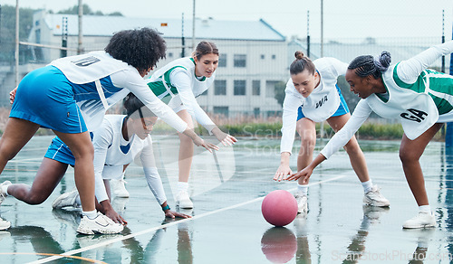 Image of Sports, ball and team netball competition, practice and women playing game, court challenge or winter match. Fitness, teamwork and group workout, tournament and athlete action, exercise or training