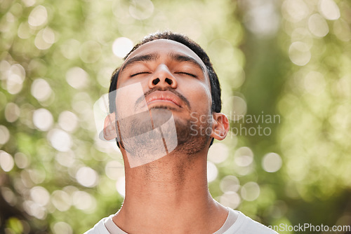 Image of Man, breathing and relax with peace in nature for exercise, workout or meditation for zen after fitness for spiritual wellness. Calm, athlete and freedom in environment and training mindfulness