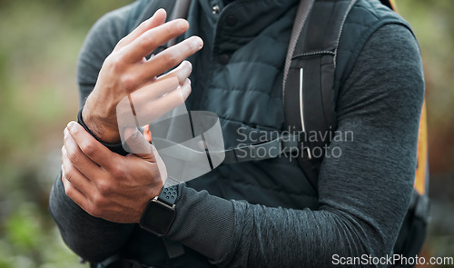 Image of Wrist, pain and hands of man hiking, outdoor and exercise with a medical accident, crisis or problem with anatomy in nature. Training, injury and athlete with trauma to muscle, joint or hand