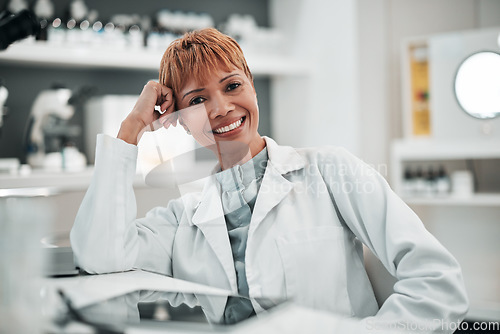 Image of Portrait, science and smile of woman doctor in the laboratory for research, innovation or breakthrough. Medical, study and a happy mature scientist working in a lab for pharmaceutical development