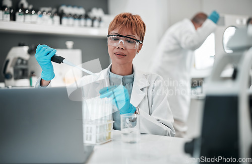 Image of Scientist, woman and dropper with test tube in laboratory for medical investigation, chemistry research or vaccine. Science, worker and dna analysis for medicine, innovation or healthcare development