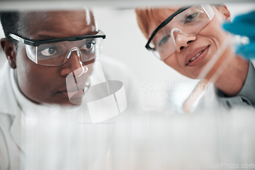 Image of Teamwork, medical and scientists with research, test tube and conversation with experiment, sample and results. Black man, woman and staff with analysis, vaccine development and cure with cooperation