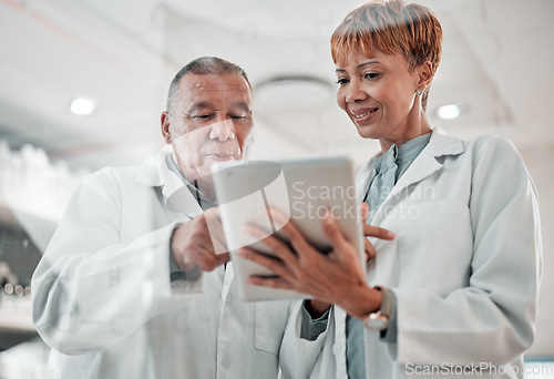 Image of Tablet, doctor and team talking in hospital for collaboration, opinion or advice for results. Man and woman or medical staff with technology for healthcare planning, online search or telehealth app