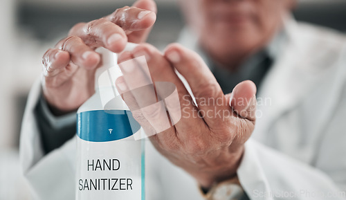 Image of Doctor, hands and press sanitizer bottle for cleaning, risk or protocol of hygiene in hospital, clinic and surgery. Closeup, healthcare and disinfection liquid for safety, flu germs or virus bacteria