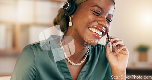 Image of Call center, consultant and black woman talking laughing, telemarketing and explain new system, process and computer. African American female agent, worker and employee with headset, speaking and tec