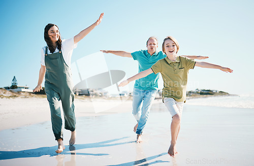 Image of Running, travel and freedom with family on beach for energy, happy and summer vacation. Love, relax and adventure with people playing on seaside holiday for health, bonding and games together