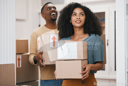 Image of Happy black couple, box and moving in new home, real estate or investment for property together. African man and woman smile with boxes in renovation, relocation or house mortgage and apartment loan