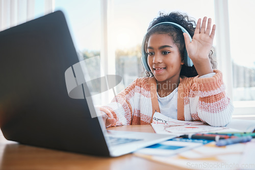 Image of Laptop, headphones and child on video call for elearning lesson for education or knowledge. Home school, technology and girl kid student wave for hello on virtual class on computer at her house.