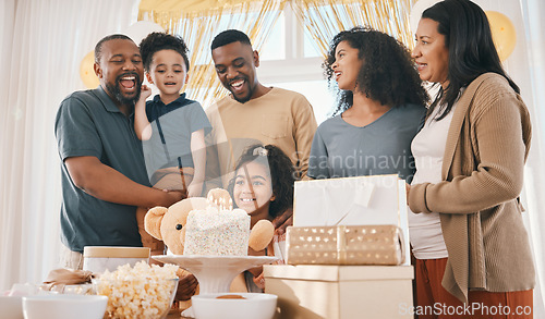 Image of Big family, birthday and celebration cake with kids, father and love together in a home with smile. Event, presents and children with dad and singing with bonding, candles and care in a house