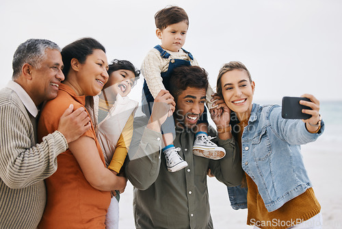 Image of Happy family, grandparents and selfie on beach for kids holiday, vacation and outdoor on social media. Mother, father and senior people with interracial children in profile picture by the ocean