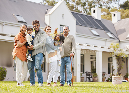 Image of Happy big family, real estate and new home on grass or lawn together in happiness for property or investment. Portrait of parents, grandparents and kids hug for house, moving in or outdoor mortgage
