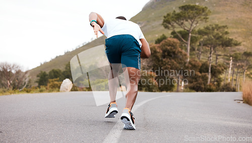 Image of Fitness, race or runner running on road by nature for exercise, training or outdoor workout. Back view, fast black man or active athlete on street with endurance, freedom or sports challenge on hill