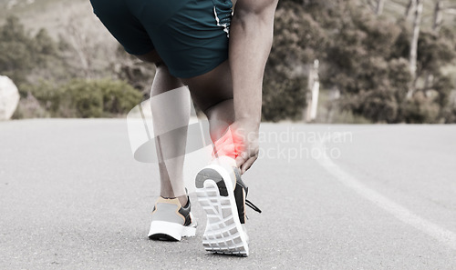 Image of Fitness, injury or runner with ankle pain on road to exercise legs in training or outdoor cardio workout. Red glow, emergency or injured sports athlete suffering from broken foot after running a race