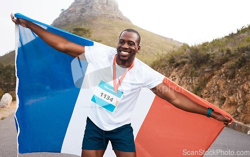 Image of Runner man, flag and winner with smile, pride and celebration for marathon, fitness and sports for France. Black guy, athlete and fabric for national sign, success or achievement at race in Cape Town
