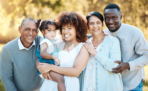 Image of Smile, portrait and child with grandparents and parents in an outdoor park for adventure, holiday or weekend trip. Happy, excited and family generations bonding and having fun in nature in a field.