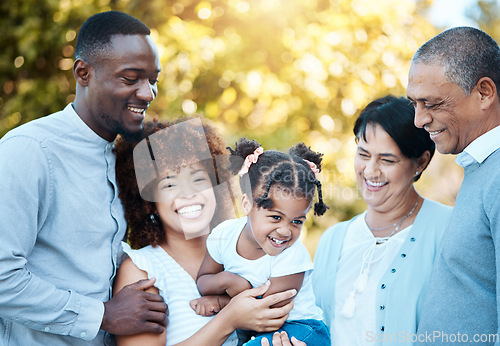 Image of Happy, love and family generations in nature at an outdoor park together for bonding. Smile, fun and girl child with grandparents and parents in a green garden on weekend trip, adventure or holiday.