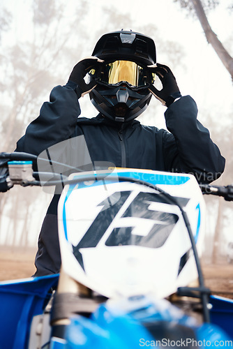 Image of Sports, dirt bike and speed with person on motorcycle in forest for challenge, training and performance. Fast, fitness and freedom with man riding in nature for travel, journey and adventure