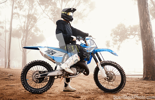 Image of Motorcycle, person and sports in woods with training for competition, ride in nature with action and helmet. Extreme, adrenaline and exercise, athlete and transport with dirt bike, freedom and travel