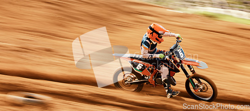 Image of Motorcycle, sand and motion blur with a sports man on space in the desert for dirt biking. Bike, fitness and speed with a person driving fast on an off road course for freedom, power or performance