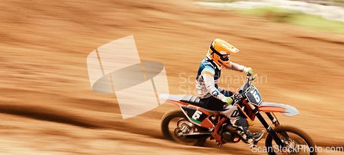 Image of Motorcycle, speed and motion blur with a man training on space in the desert for dirt biking. Bike, fitness and sports with a person driving fast on an off road course for freedom or performance