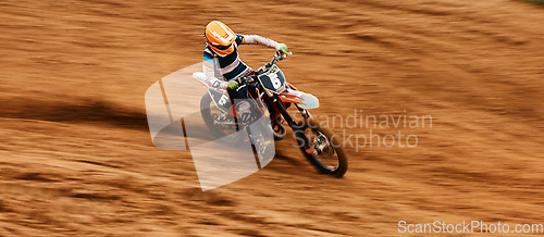 Image of Bike, dust and motion blur with a sports man on space in the desert for dirt biking. Motorcycle, exercise and power with a person driving fast on sand or off road course for freedom or performance