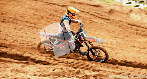 Image of Motorcycle, dust and motion blur with a sports man on space in the desert for dirt biking. Bike, fitness and speed with a person driving on sand or off road course for freedom or performance