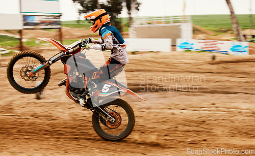 Image of Motorcycle, power and motion blur with a sports man on space for dirt biking race or challenge. Bike, fitness and speed with a person driving fast on an off road course for freedom or performance