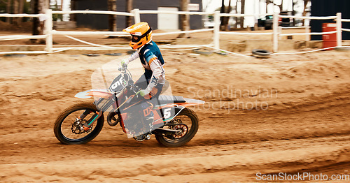 Image of Motorcycle, fitness and motion blur with a sports man on space at an off road course for dirt biking. Bike, balance and power with a person driving fast during a race for freedom or performance