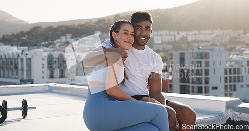 Image of Fitness, couple for hug during exercise, workout or training together in the urban city. Happy woman, man and care in a conversation, communication or talking after cardio break on a rooftop