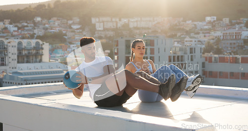 Image of Health, medicine ball and fitness with couple in city for training, sports and support. Wellness, workout and exercise with man and woman on rooftop for challenge, teamwork and motivation together