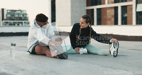 Image of Fitness, couple and stretching body on rooftop in workout, exercise or outdoor training together. Happy man and woman in warm up or getting ready for cardio, practice or sports preparation in city