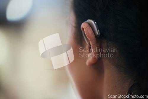 Image of Hearing aid, closeup and ear with a person with a disability for helping with audio and medical implant. Technology, patient and healthcare problem with listening support and wellness tool with back